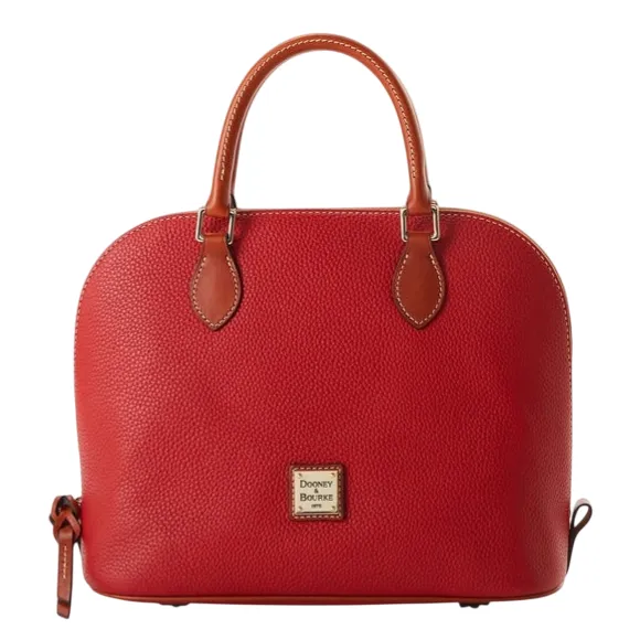 A red leather satchel with top handles, featuring a pebbled texture and a small logo plaque on the front.