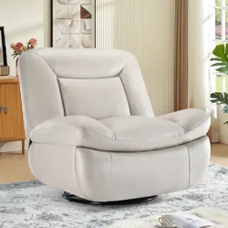 A beige swivel reclining chair with plush cushioning is featured in a cozy living room setting, complemented by a patterned rug and natural light from a large window.