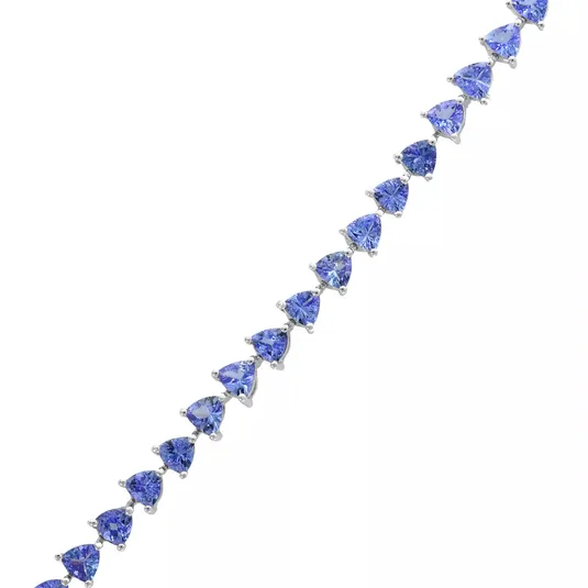 A bracelet featuring heart-shaped blue gemstones set in a silver-tone metal.