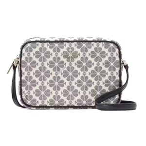 A patterned crossbody bag with a zip closure and an adjustable strap.