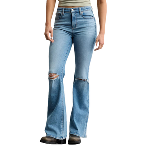 Light blue flared jeans with distressed details on the knees, paired with black shoes.