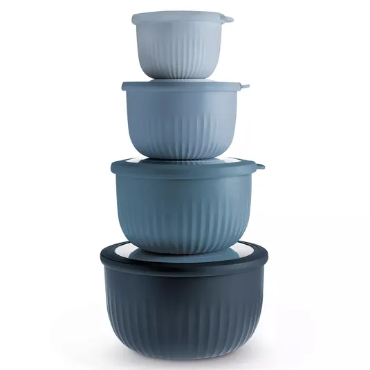 A stack of four nesting bowls with lids, in varying shades of blue, featuring a ribbed texture.