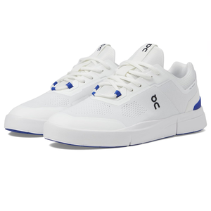 White and blue tennis shoes featuring mesh uppers for breathability, lace-up closure, and cushioned soles with the \“On\“ logo on the sides and tongue.