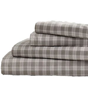 Stack of folded bed sheets with a gray plaid pattern.