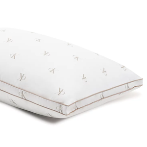 A white pillow with a repeating pattern of the Calvin Klein logo.