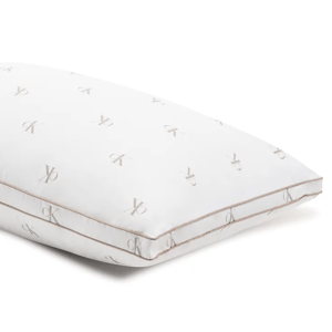 A white pillow with a repeating pattern of the Calvin Klein logo.