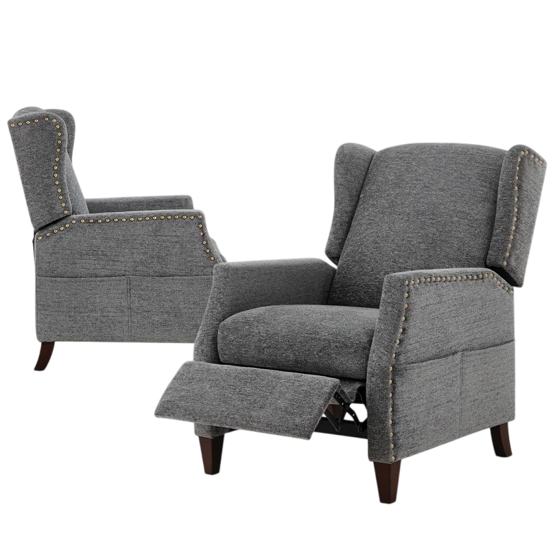 Two gray reclining armchairs with wingback design and brass nailhead trim, featuring wooden legs and upholstered fabric.