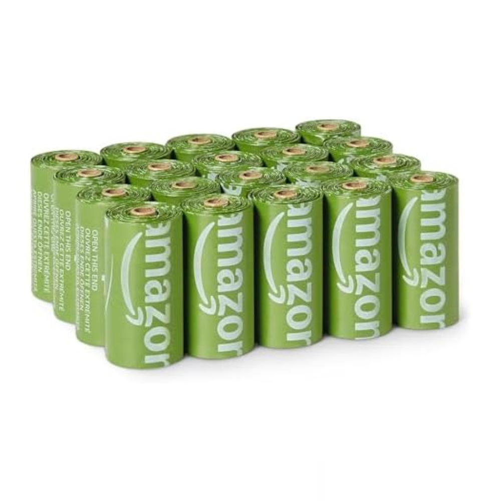 A pack of green AmazonBasics trash bags, with each roll labeled with the Amazon logo.