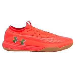 Bright red athletic shoe with a gum sole, featuring the Under Armour logo on the side.