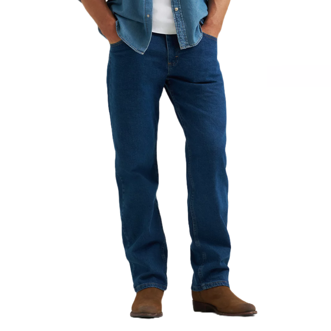 Wrangler Men's Jeans in a classic medium blue, straight-leg fit, featuring a traditional five-pocket design. Paired with a denim shirt and brown boots.