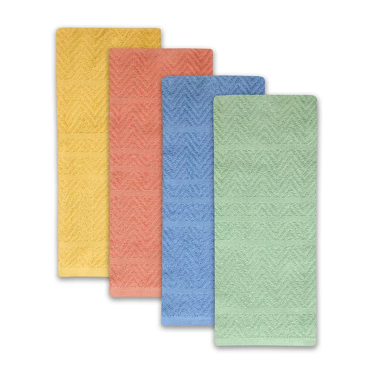Four rectangular bath mats in yellow, coral, blue, and green, featuring a textured, chevron pattern.