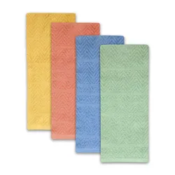 Four rectangular bath mats in yellow, coral, blue, and green, featuring a textured, chevron pattern.