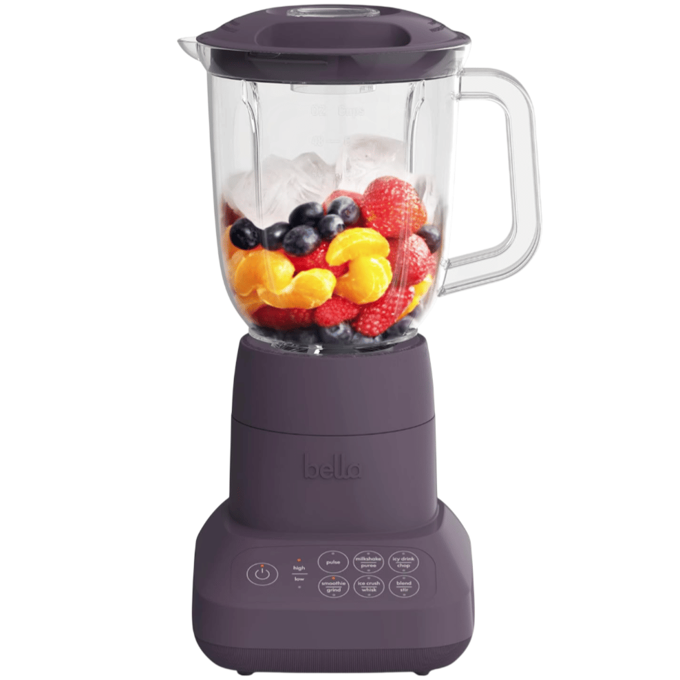 A dark purple Bella blender with a clear jug, showing a mixture of ice and colorful fruits like oranges, strawberries, raspberries, and blueberries. The control panel includes settings for pulse, smoothie, ice crush, and more.