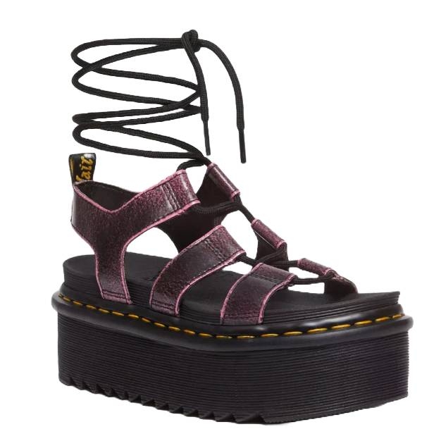 Platform sandal with black laces and pink straps, featuring a tall sole with yellow stitching detail.