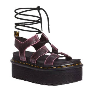 Platform sandal with black laces and pink straps, featuring a tall sole with yellow stitching detail.