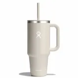 Beige Hydro Flask tumbler with a handle, lid, and straw, featuring the brand's logo.