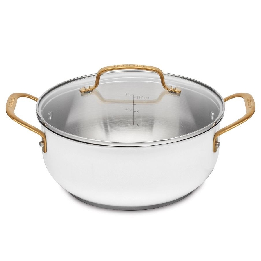 Cuisinart 4.5qt Dutch Oven with a stainless steel body, clear lid, and gold-tone handles. The internal markings show measurements up to 3 liters or 12 cups.