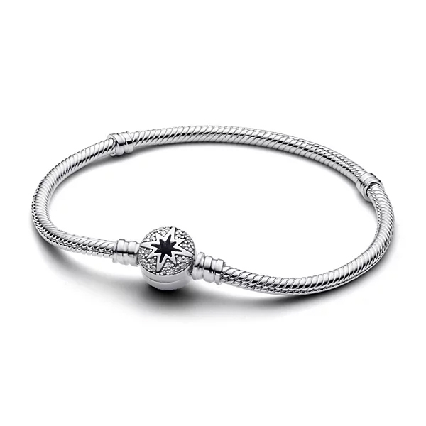 A silver bracelet features a snake chain design with a star and crystal-embellished clasp.