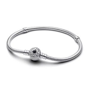 A silver bracelet features a snake chain design with a star and crystal-embellished clasp.