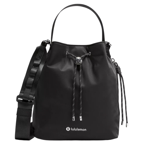Black Lululemon Bucket Crossbody bag with drawstring closure, adjustable shoulder strap, top handle, and small logo on the front.