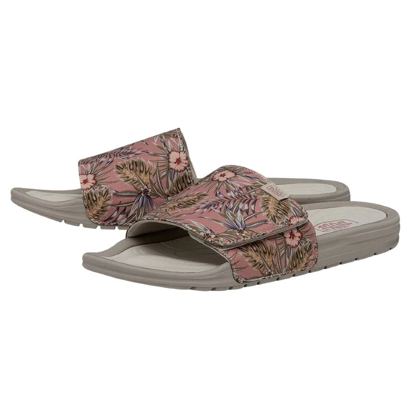 A pair of floral-printed slide sandals with a single wide strap over the foot.