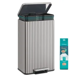 A rectangular, silver, pedal-operated trash can with a ribbed design, shown with compatible 40-50L drawstring bags.