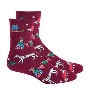 Maroon socks with festive holiday patterns featuring dogs, presents, and snowflakes.
