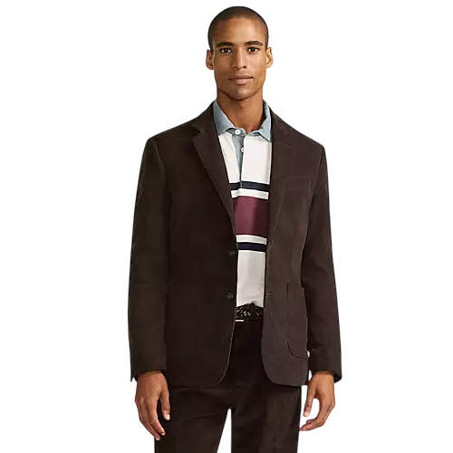 A man is wearing a dark brown corduroy blazer over a striped polo shirt with navy, burgundy, and white stripes.