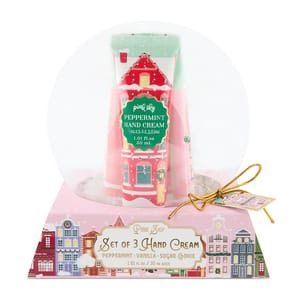 Pink Sky Snow Globe Hand Cream Gift Set includes three 30 mL tubes of hand cream in Peppermint, Vanilla, and Sugar Cookie scents, packaged in a decorative snow globe design box.