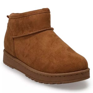 A brown suede ankle boot with a flat platform sole and minimalist design.