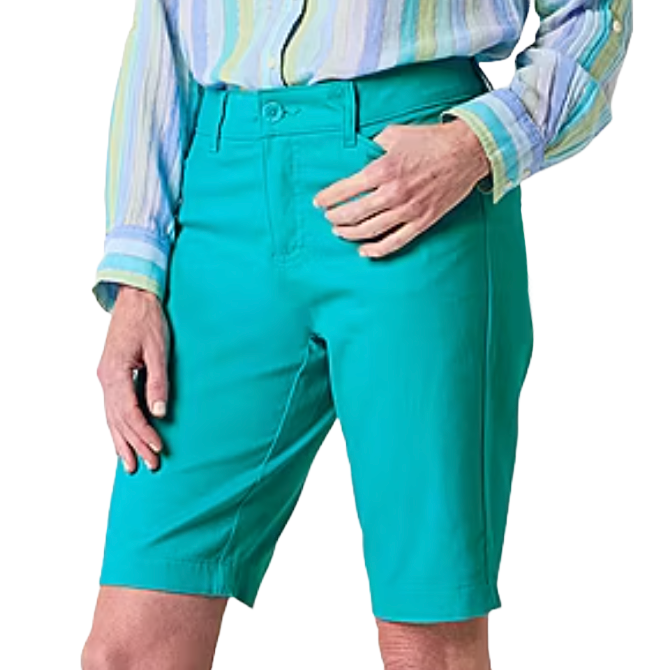 A person is wearing bright turquoise knee-length shorts with a striped long-sleeve button-up shirt.