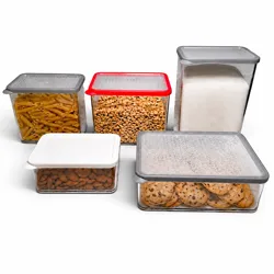 A set of clear, rectangular storage containers with colored lids, containing pasta, cereal, sugar, almonds, and cookies.