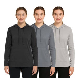 Three women wearing hoodies in black, medium gray, and light gray. Each hoodie features a kangaroo pocket and drawstring hood.