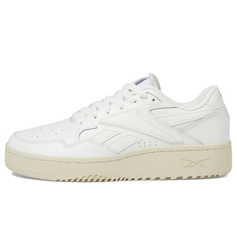 White Reebok sneaker with light beige sole, featuring a classic low-top design and perforated detailing on the sides.