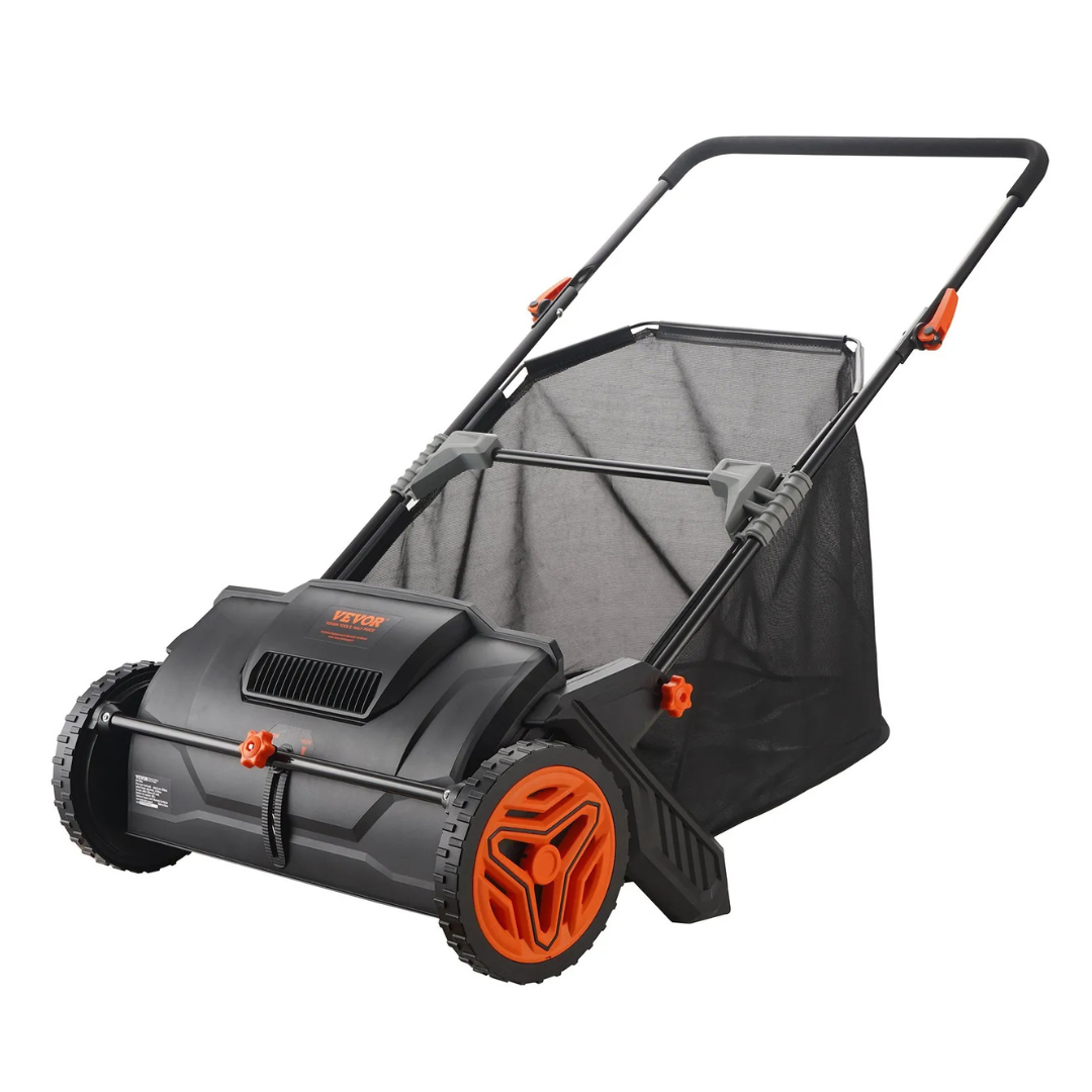 A black and orange manual push lawn sweeper with a mesh grass collector and sturdy wheels.