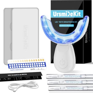LED teeth whitening kit with a mouth tray, three teeth whitening pens, a USB charging cable, a tooth color chart, and a storage case.