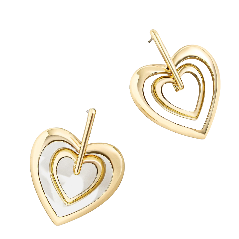 A pair of gold heart-shaped earrings with concentric, smaller heart cutouts.
