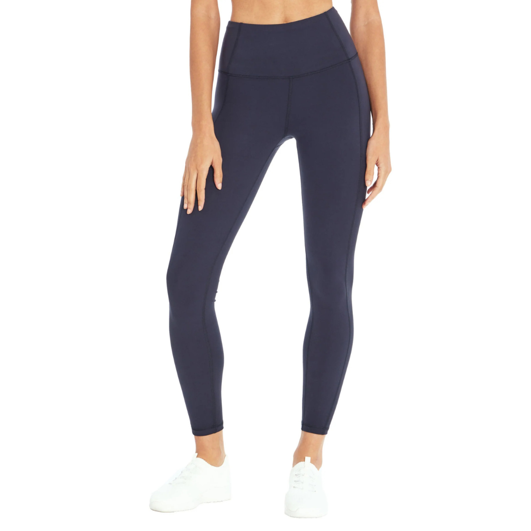 Navy blue high-waisted leggings paired with white sneakers.