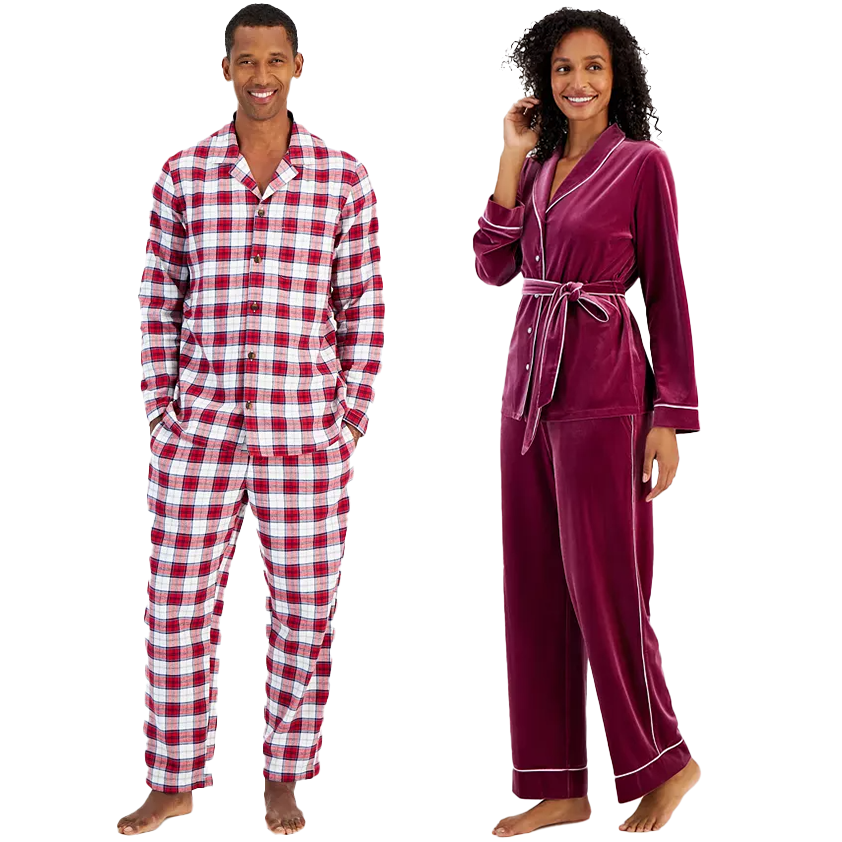 A man in a red and white checked pajama set and a woman in a burgundy velvet pajama set with white trim.