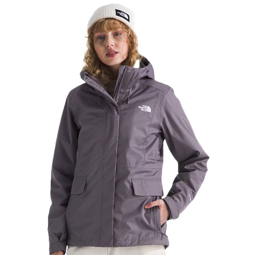 The North Face Monarch Triclimate Jacket is a gray, waterproof, and insulated 3-in-1 jacket featuring a detachable hood, multiple pockets, and The North Face logo on the chest, designed for versatile outdoor wear.