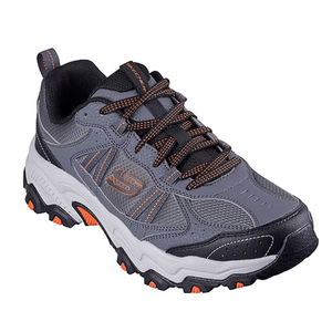 Gray and black athletic shoe with orange accents and a rugged sole, featuring a logo on the side.