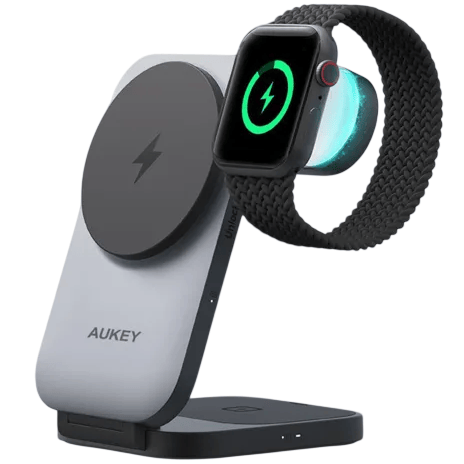 A dual wireless charging stand for a smartphone and smartwatch, featuring the AUKEY logo and MagSafe compatibility. It supports simultaneous charging of both devices.