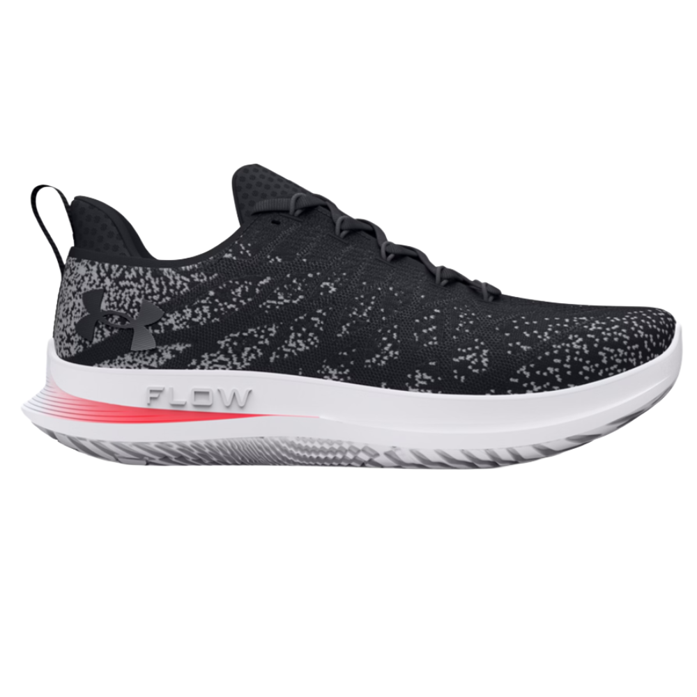 Under Armour running shoe, black with gray and white speckles, features a cushioned midsole labeled \“FLOW\“ and a black heel pull tab.