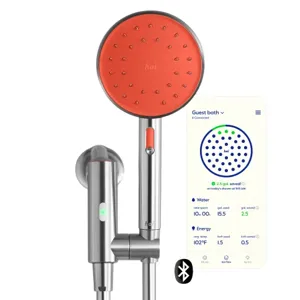 A smart showerhead with an orange face and metal handle, paired with a smartphone app interface displaying water and energy usage data, featuring Bluetooth connectivity.