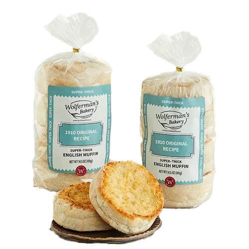 Wolferman's Bakery 1910 Original Recipe super-thick English muffins are shown in two packs alongside two toasted muffin halves.