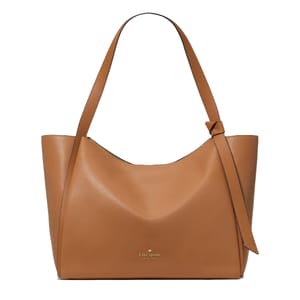 A tan leather tote bag adorned with a knotted strap detail and a logo near the bottom center.
