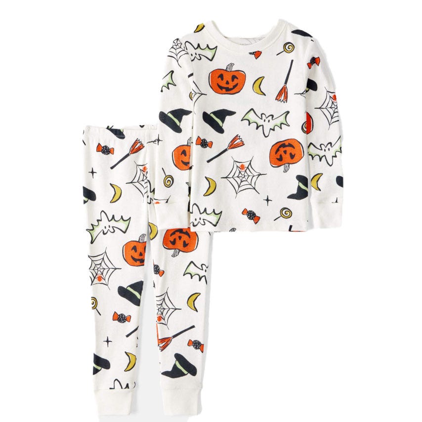 White long-sleeve pajama set featuring a Halloween theme with pumpkins, witch hats, brooms, ghosts, bats, candy, spider webs, and crescent moons.