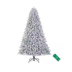 A snow-flocked artificial Christmas tree with dense branches, featuring multicolored lights and a sturdy metal stand.