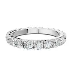 A silver ring featuring a continuous band of round-cut diamonds.