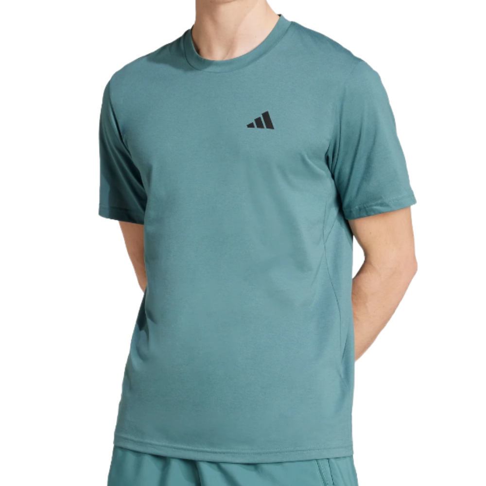 A light teal short-sleeve T-shirt with a small black geometric logo on the upper left chest, designed for casual or athletic wear.